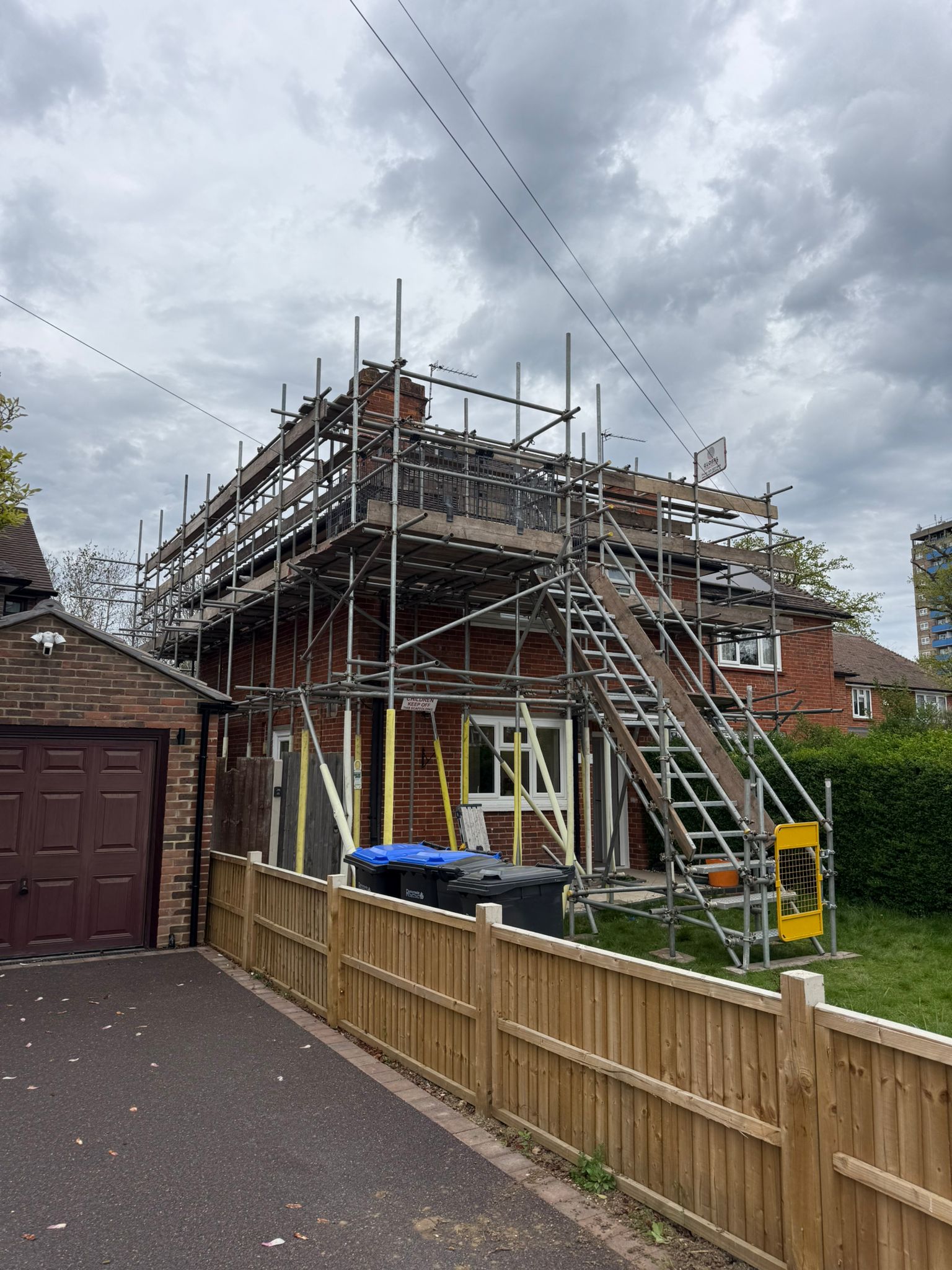 Scaffolding around a house with external staircase access
