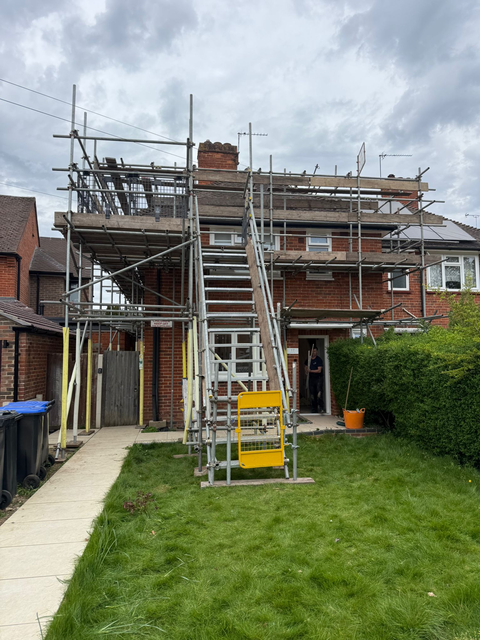 House scaffolding with staircase leading to roof-level platforms