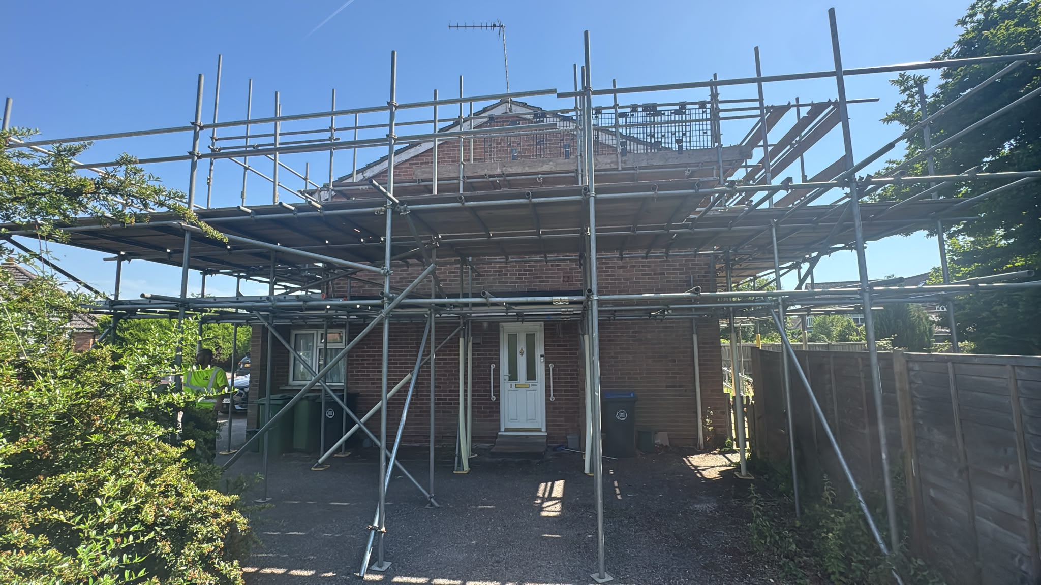 Scaffolding around an individual brick property